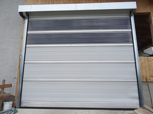 Puerta de granero - ADK - Oberleitner Windschutz GmbH & Co. KG - enrollable / de aluminio