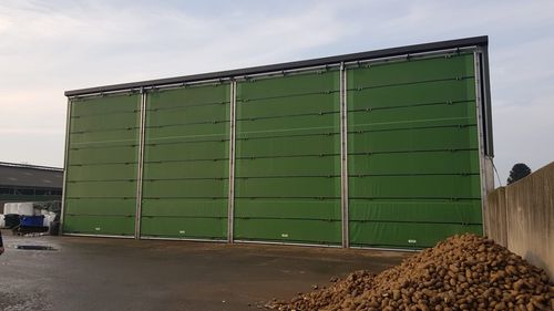 Porte pour bâtiment d'élevage - Mammothdoor - Vervaeke - pour bâtiment de stockage / à enroulement / en acier inoxydable