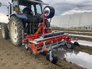 automatic plastic mulch unroller