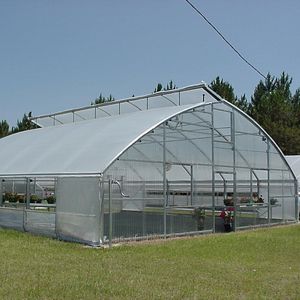 Greenhouses, their construction and equipment . Fig. 63.—Glazing with  double glazing points lower corner. The upper edge is kept inplace by the  bottom of the pane above it. Ad-ditional points are required