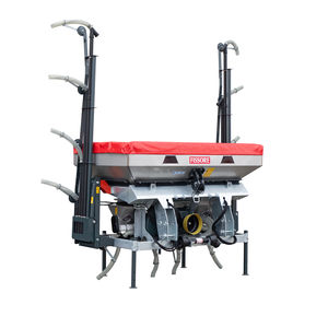 mid-row fertilizer spreader