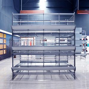broiler rearing cage with manure removal system