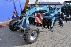 mounted field cultivator / with roller / 3-point hitch / spring tine