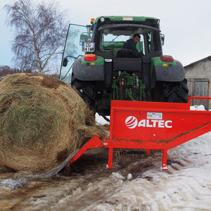 tractor-mounted bale unroller