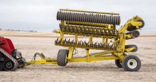 Towed field cultivator - PTL series - Degelman Industries Ltd. - with roller / folding / with disk harrow