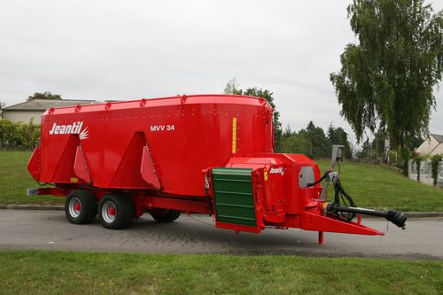 Vertical mixing wagon - MVV 20 C - JEANTIL S.A. - towed / side discharge / 2-auger
