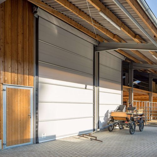 Barn door - Lubratec® Stabidoor - HUESKER Synthetic GmbH - for livestock buildings / for storage building / aluminium