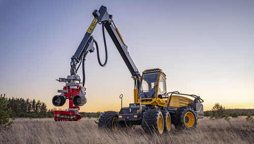 Rubber-tired forestry harvester - 580E - ECO LOG SWEDEN AB - with crane