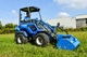 rubber-tired loader / with cab / mini / electric