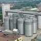 flat-bottom silo / for grain / concrete / metal