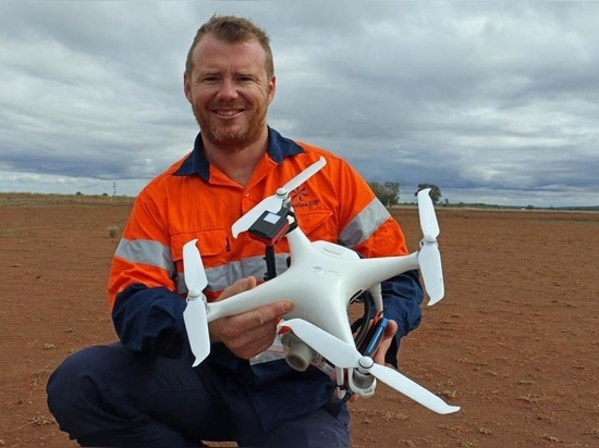 Australian UAV's Lachlan Feeney with a DJI Phantom 4 drone adapted for ag use.